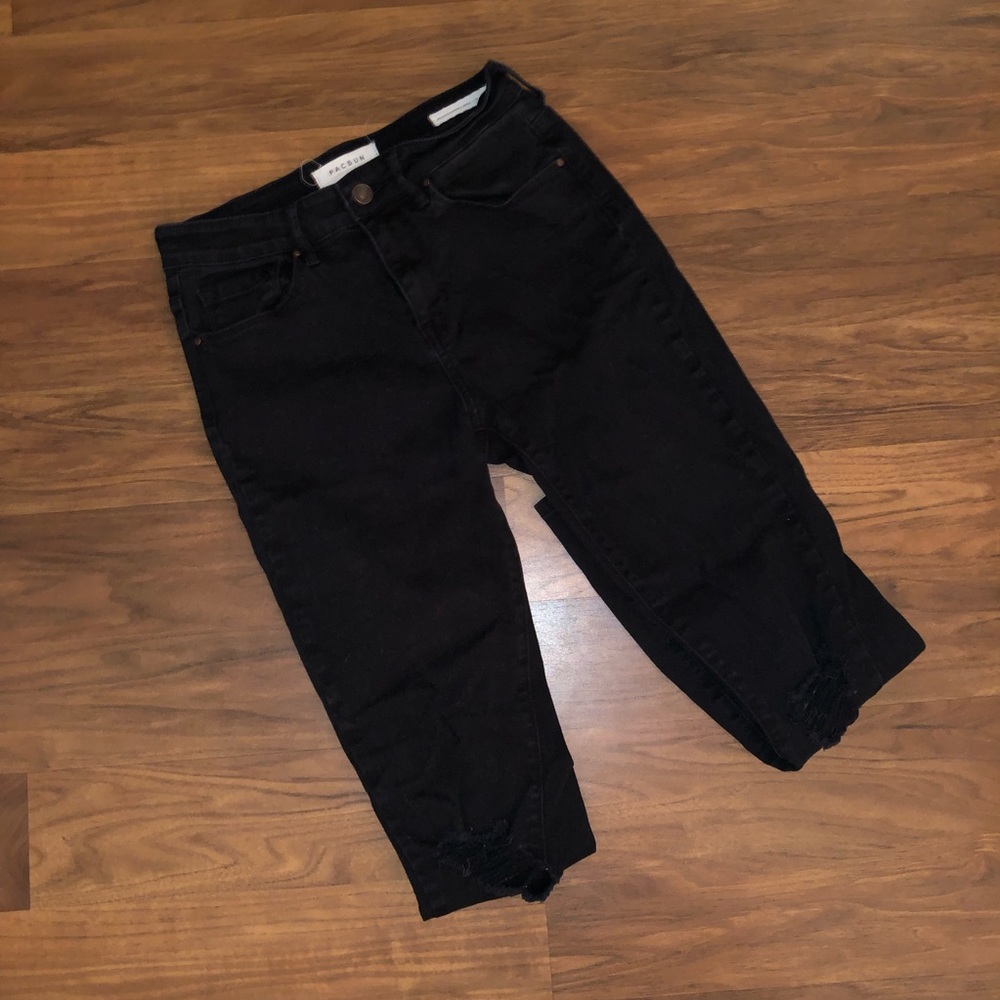 Ripped knee jeans.